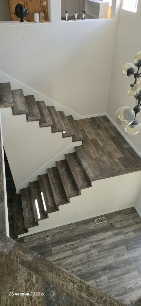 Rustic dark wood staircase remodel in Bellevue, Washington