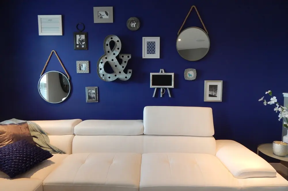 Freshly painted living room with a deep navy accent wall