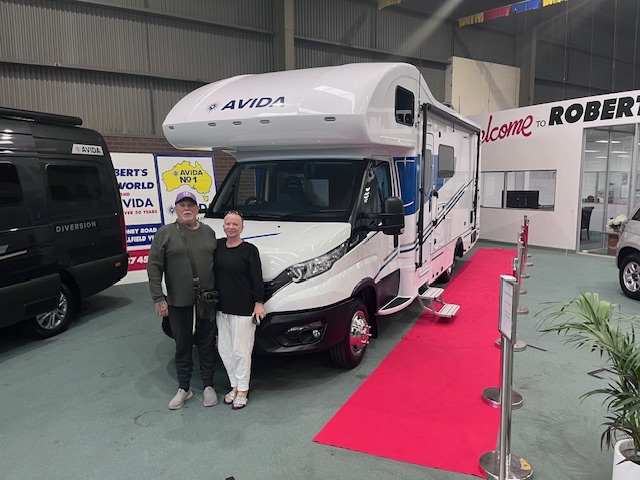 Happy customers collecting a motorhome in Melbourne