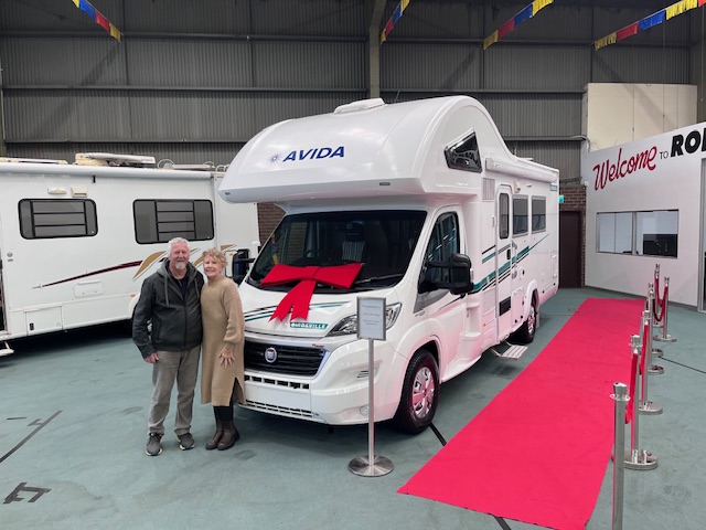 Happy Roberts RV World customers collecting their motorhome