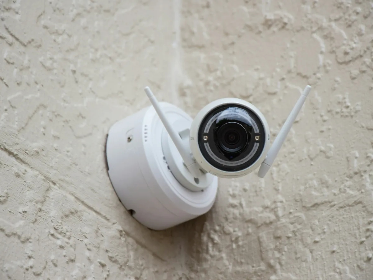 White security camera mounted on an outside wall