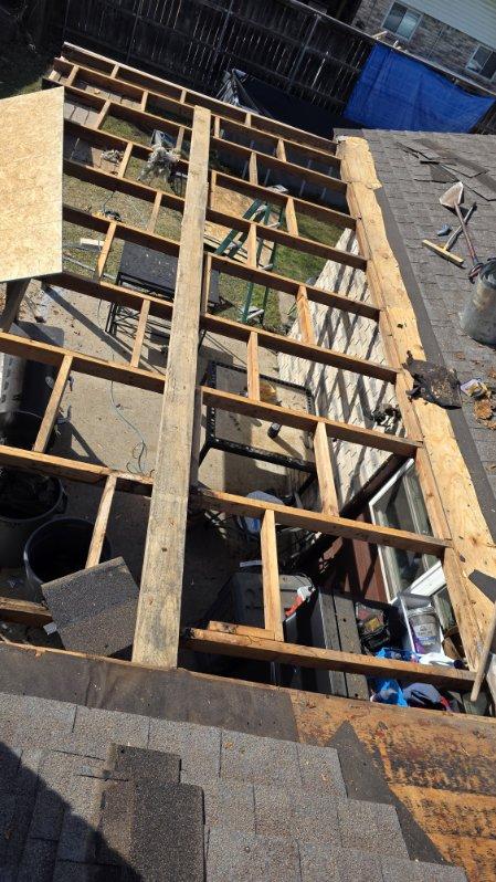 Team of roofing contractors working on a commercial flat roof