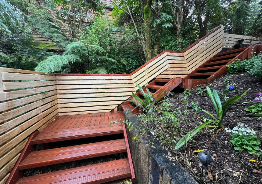 Timber panelling installed along outdoor steps blending with native bush – Twin Lakes Landscaping project