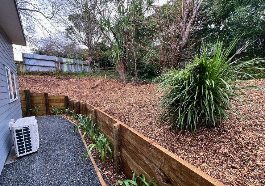 Scenic view from landscaped property featuring low-maintenance bark mulch garden