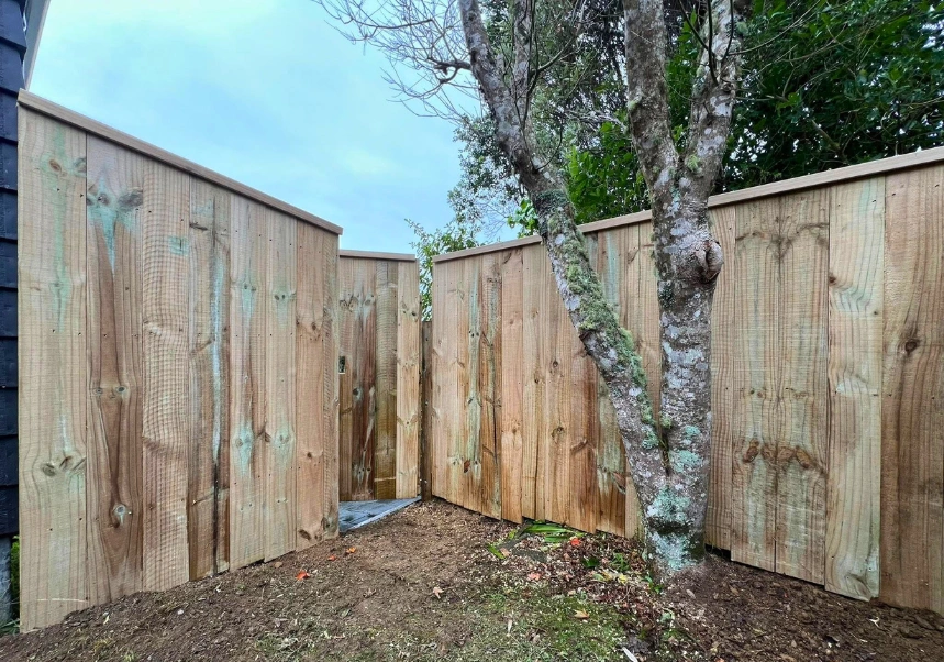 Side view of custom fence and gate built by Twin Lakes Landscaping in Wellington