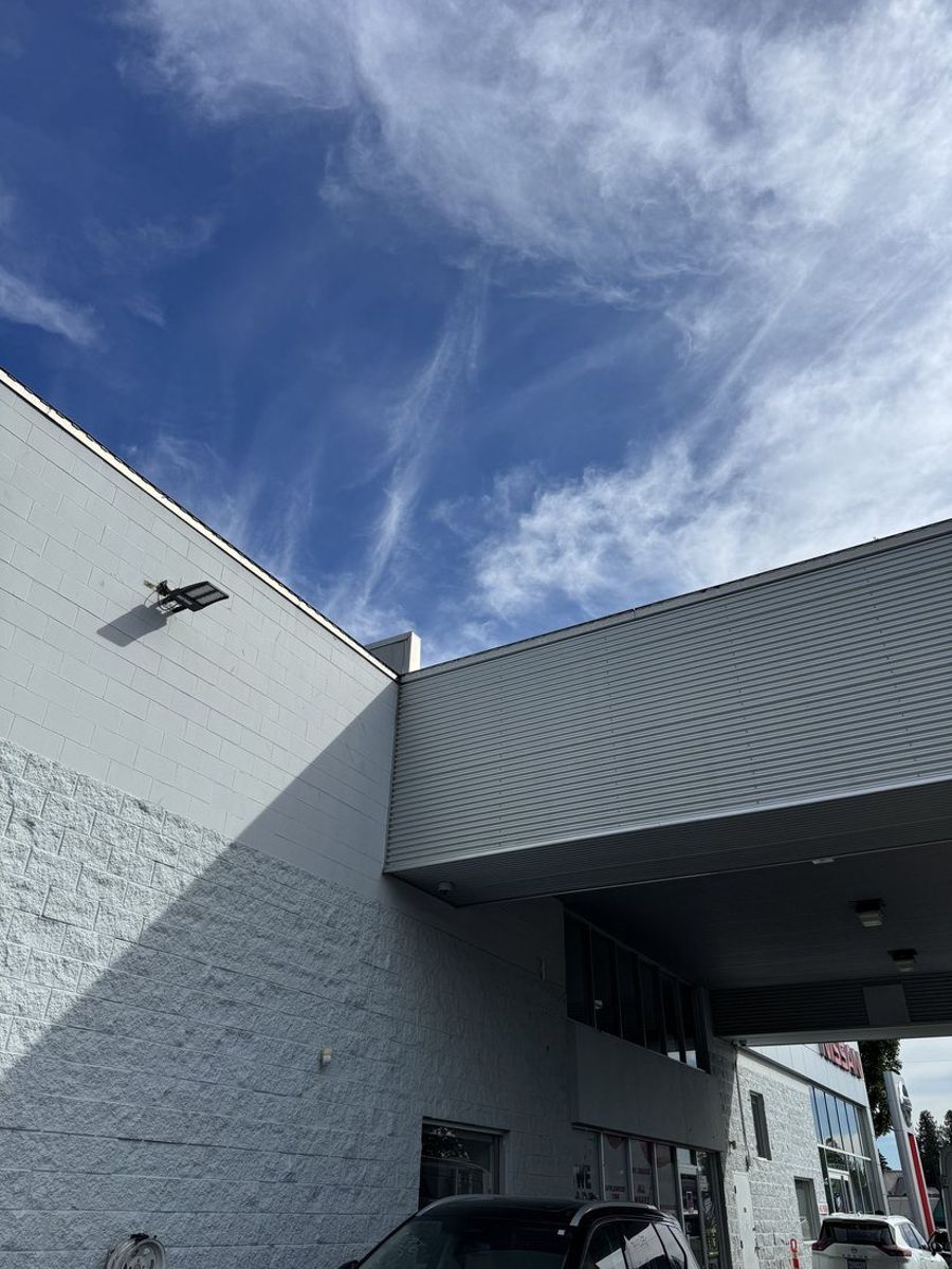 After: clean ribbed metal canopy panel at Applewood Nissan