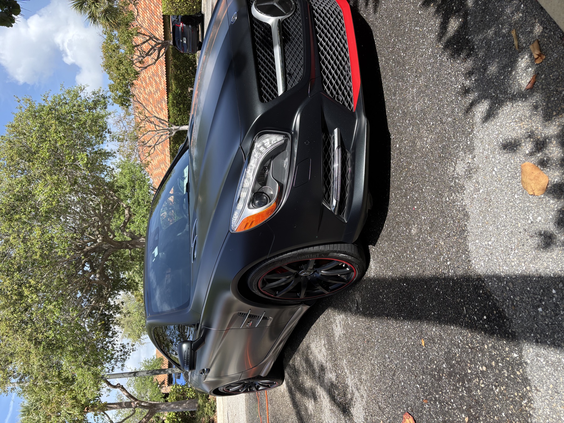 Black AMG Mercedes SL with red accents &mdash; detailed by Dany