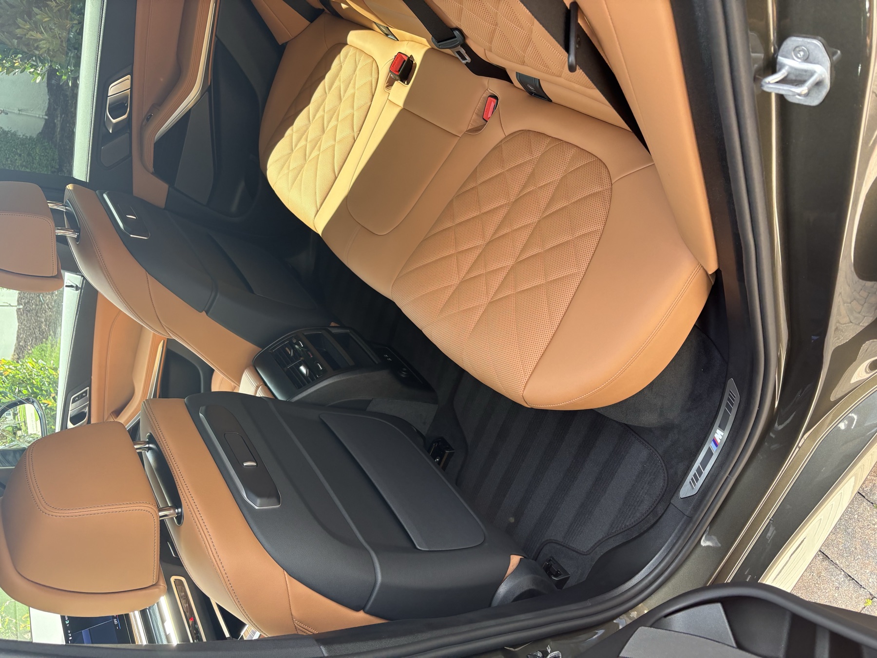 BMW interior &mdash; cognac diamond-stitched rear seats