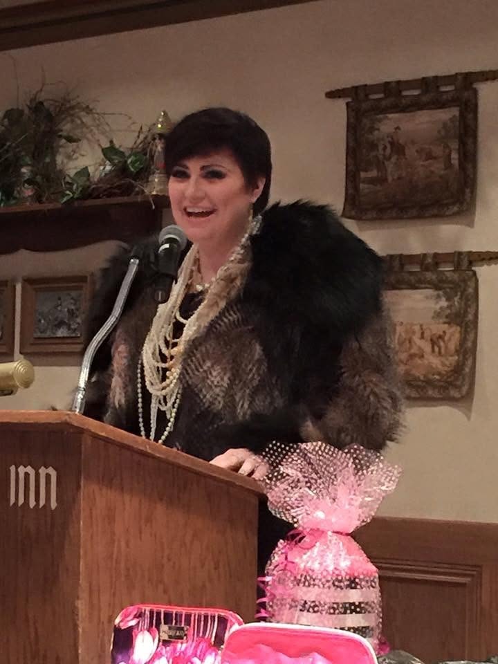 Tiffany Noel Taylor speaking at a podium