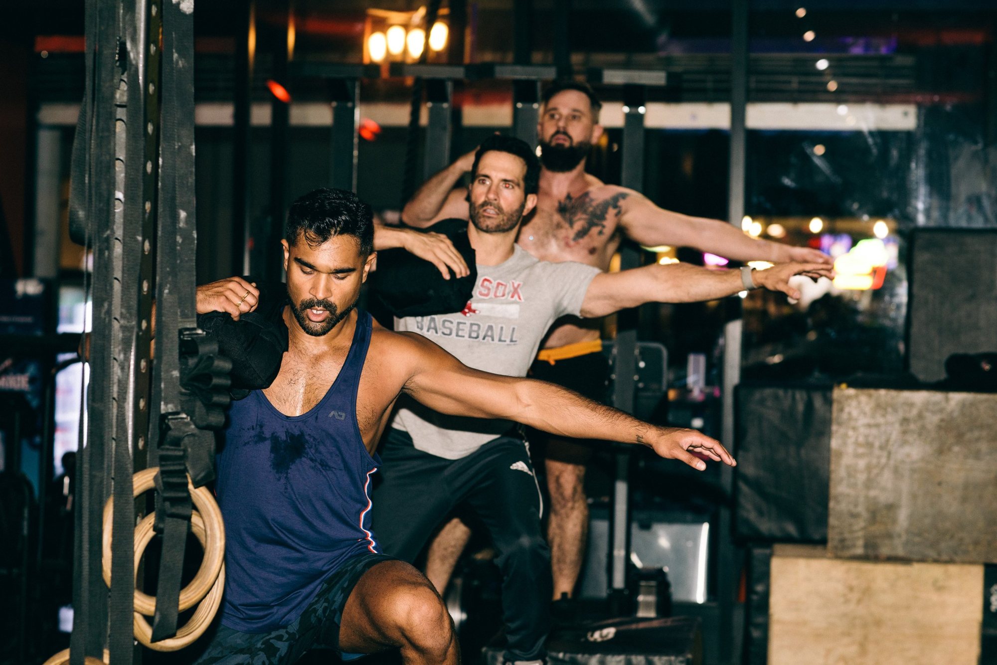 A group doing sandbag lunges together