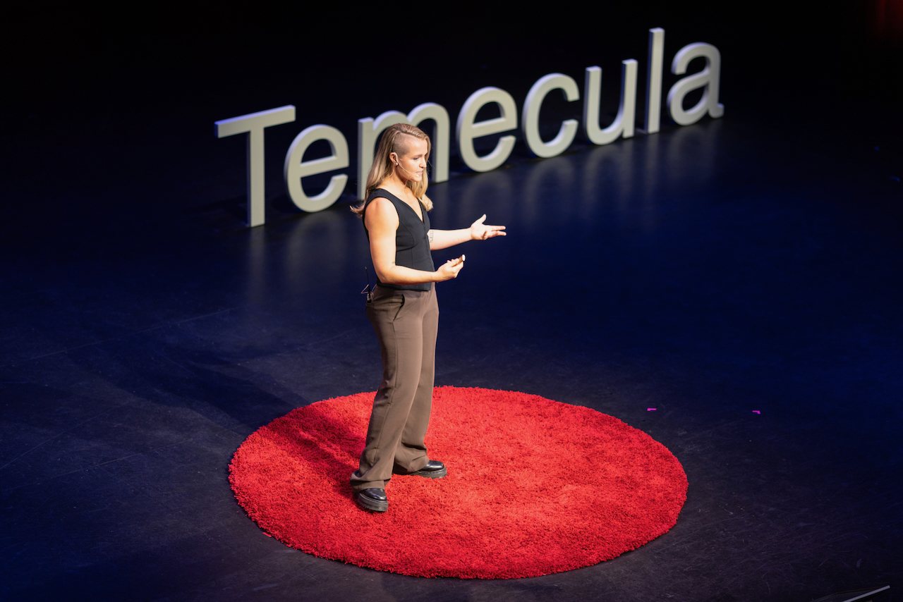 Beth Bishop, founder of The Phoenix Effect, speaking on the TEDx Temecula stage