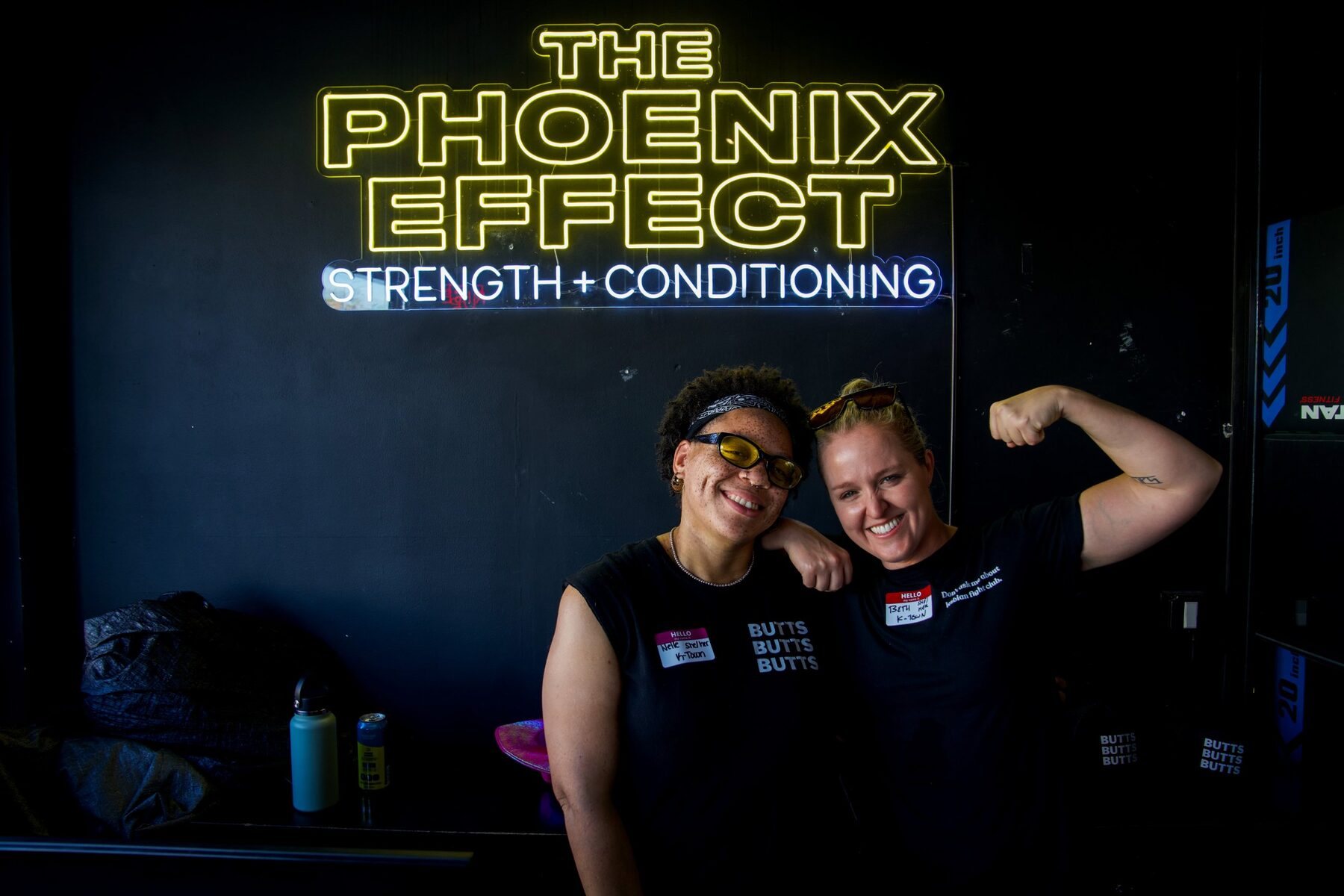 Beth and Nelle under the Phoenix Effect neon sign