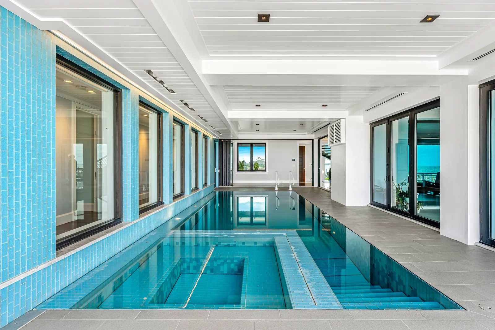 Long turquoise covered pool with leading lines