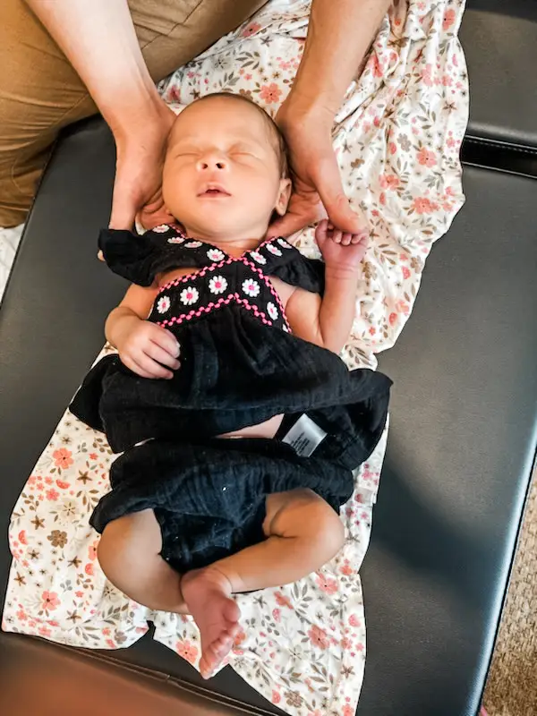 Baby getting a chiropractic session