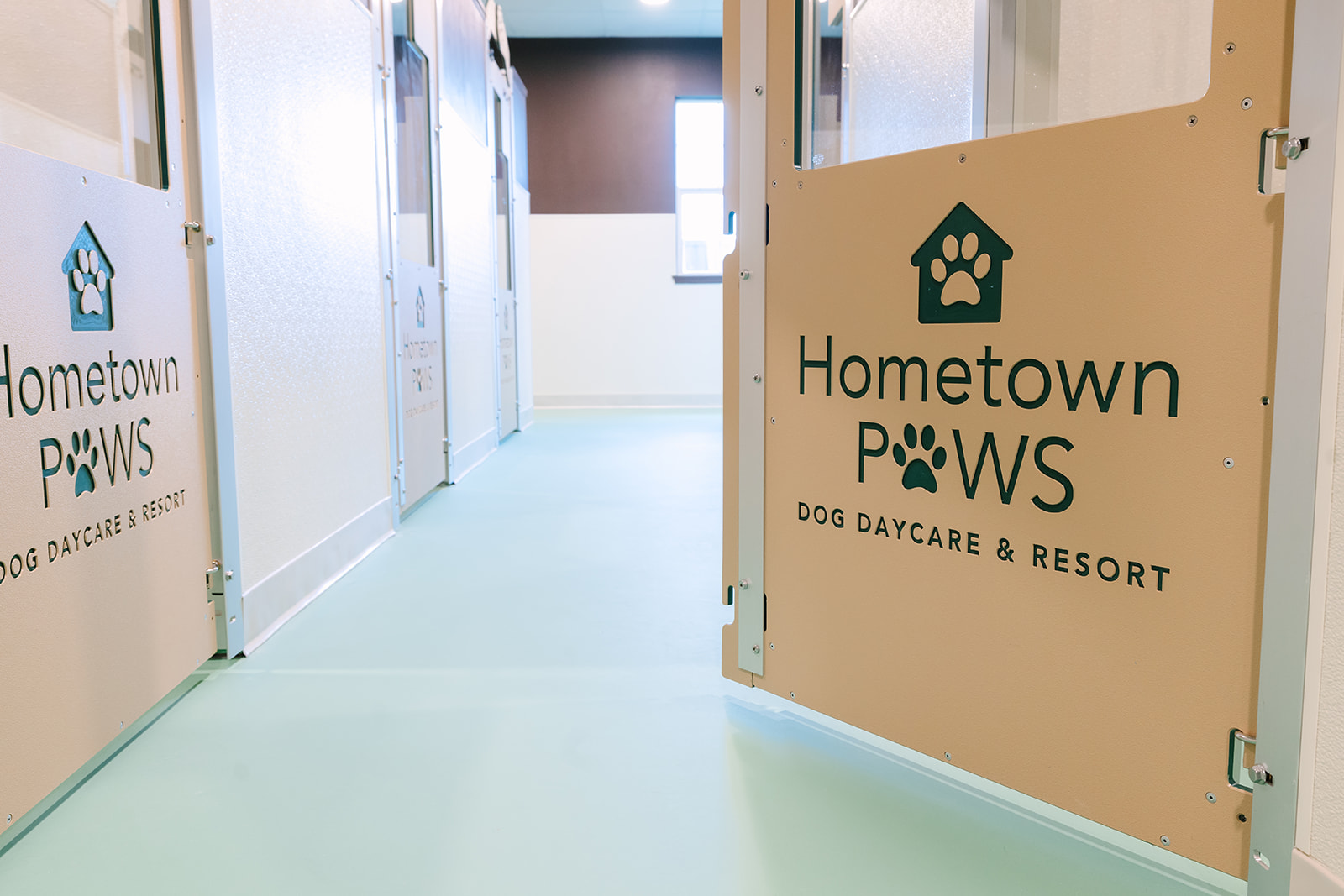 Private suite door with the Hometown Paws logo