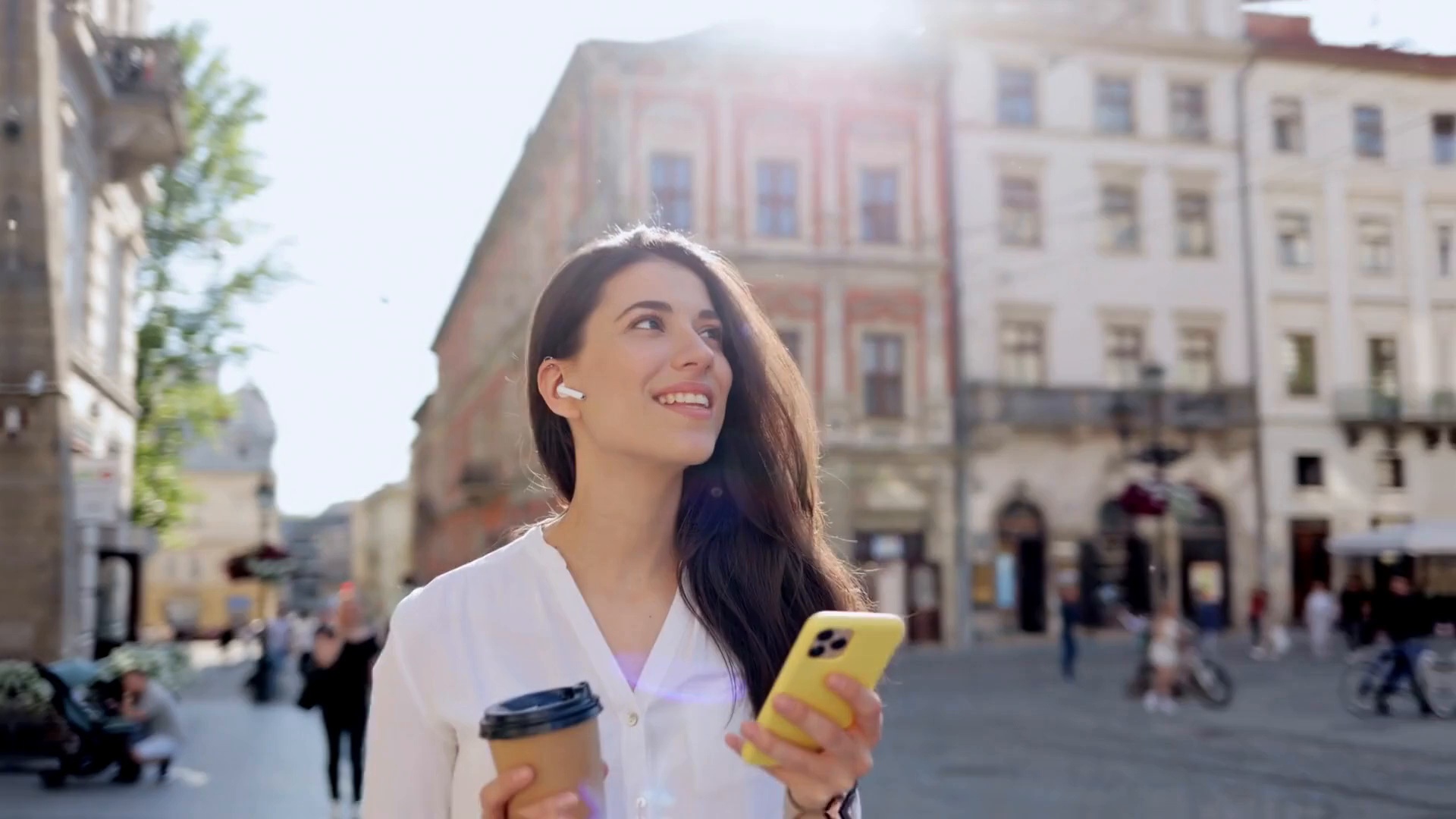 A woman holding a phone in the PowerSURGE process film