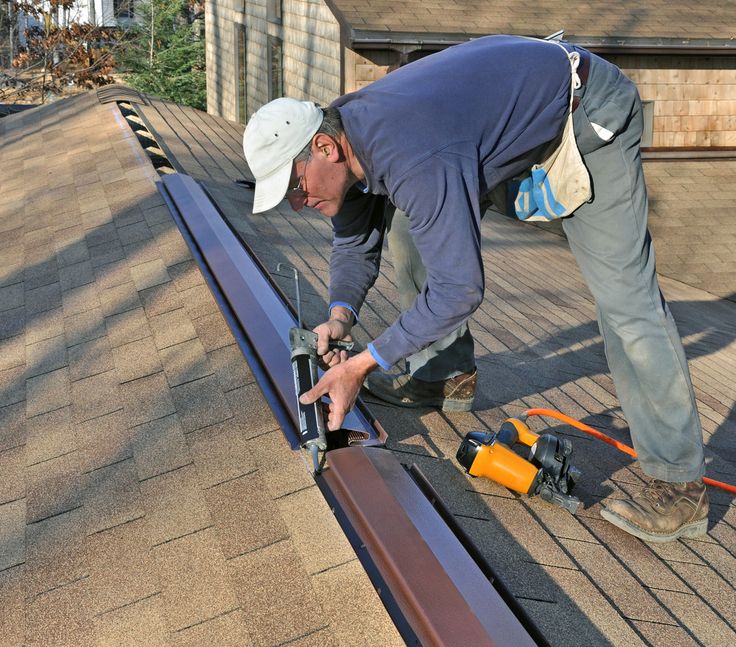 New ridge cap on a shingle roof in Manchester