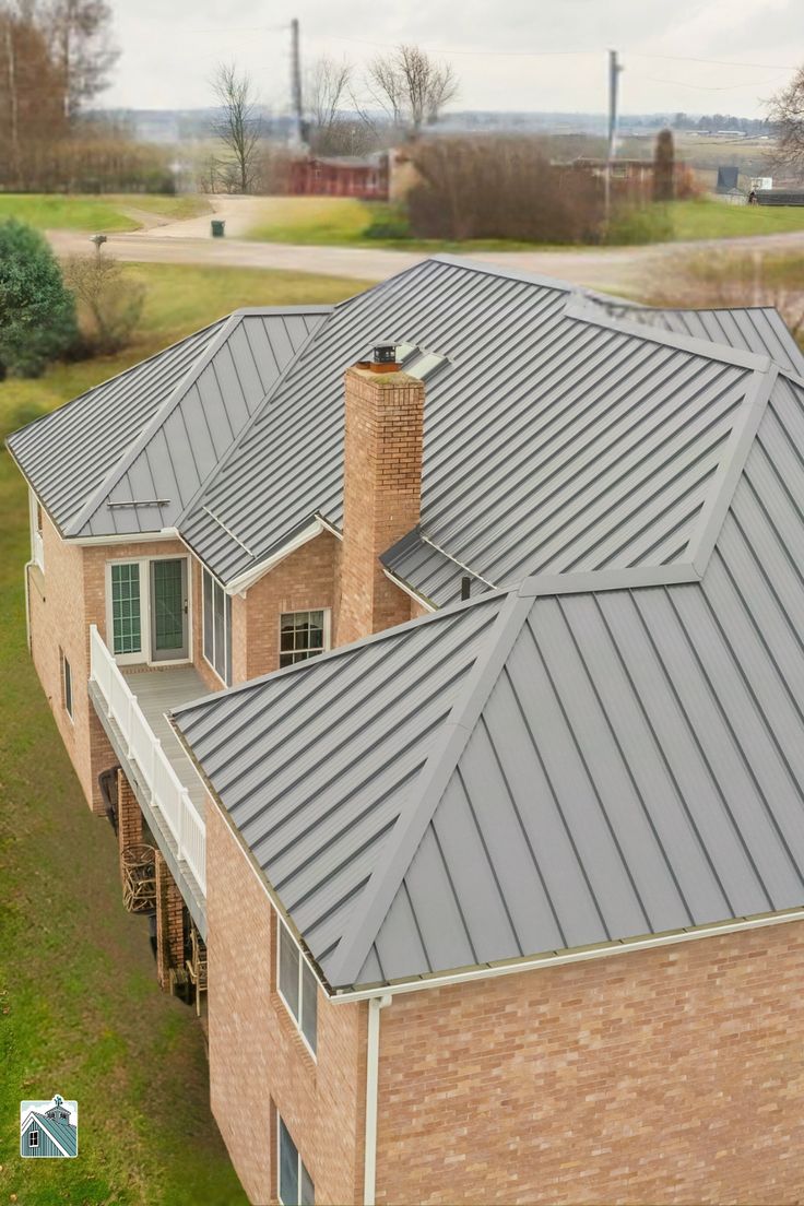 Dark standing seam metal roof panels in Manchester by IronPeak Roofing