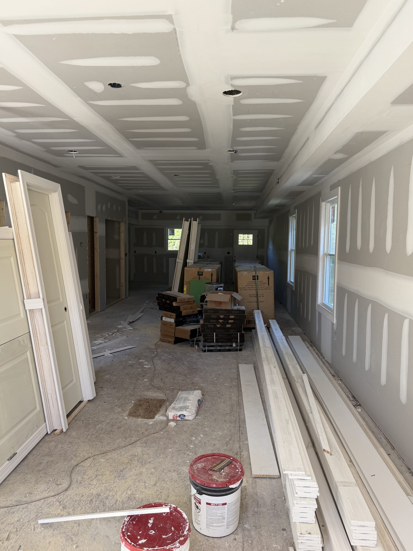 Drywall taped and mudded, interior doors staged
