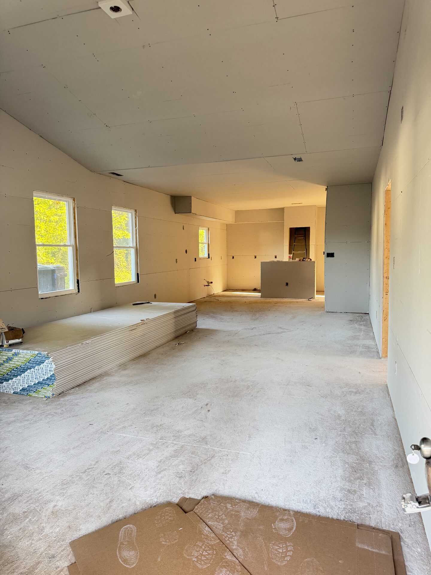 Drywall hung throughout the open living area