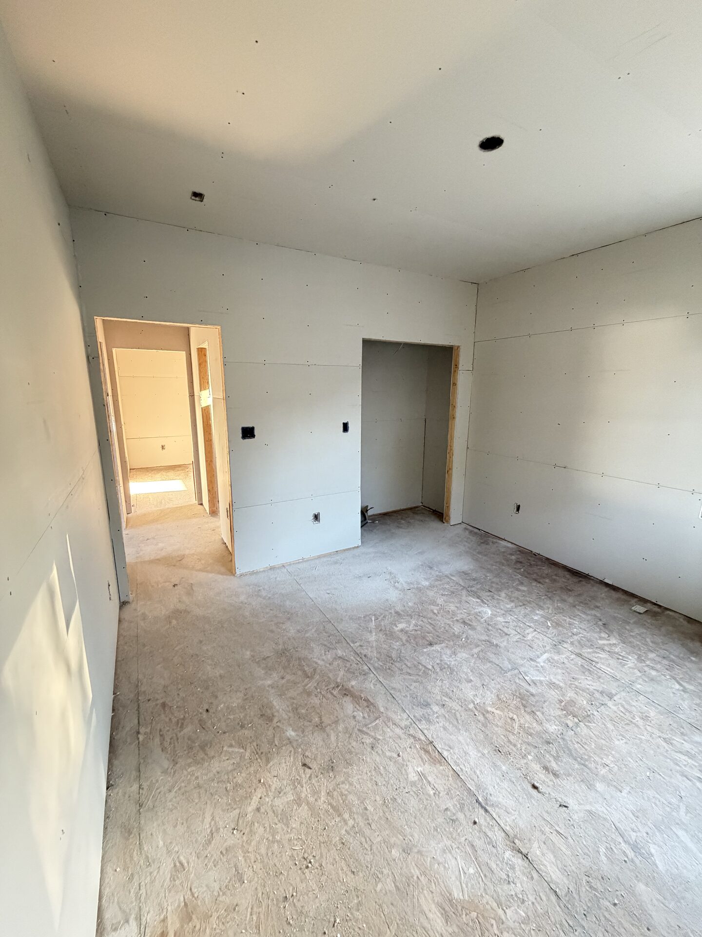 Bedroom and closet drywalled, ready for finishing