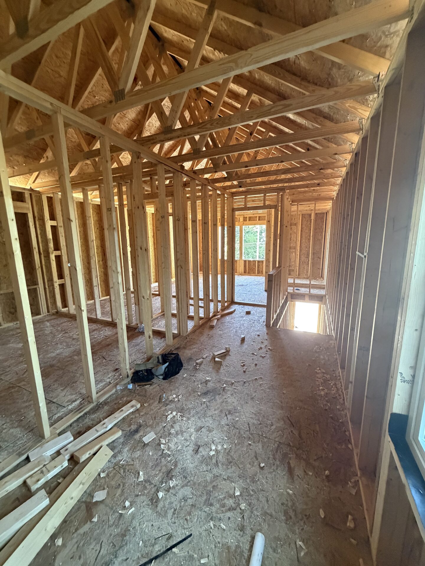 Upstairs hallway framing beside the open stairwell