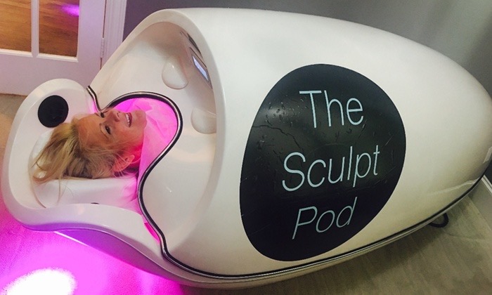 Client relaxing inside The Sculpt Pod