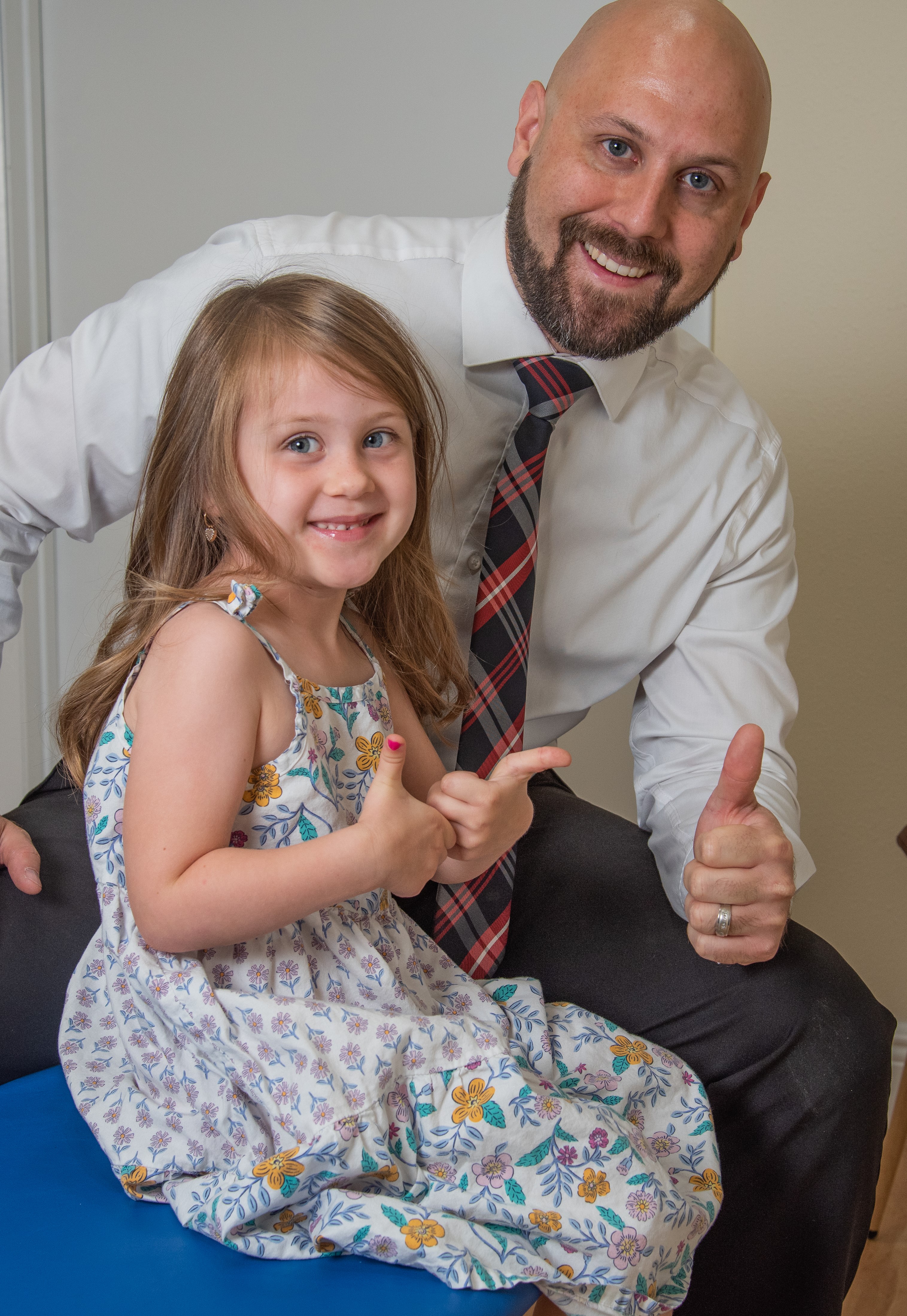 Doctor with child at Restoration Family Chiropractic