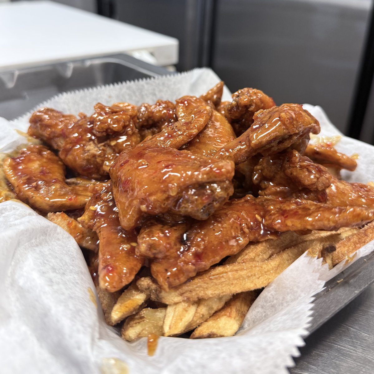Crispy party wings glazed in BBQ sauce at Pee Wee's Soul Food, Rock Island IL