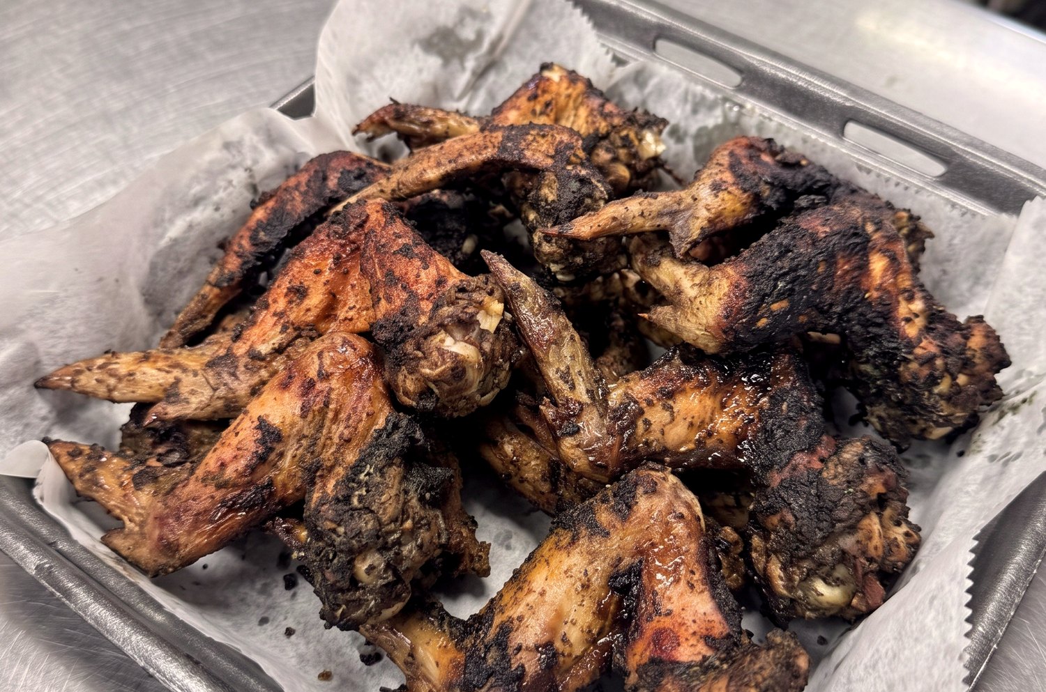 Jamaican jerk wings charred and spicy at Pee Wee's Soul Food, Rock Island IL