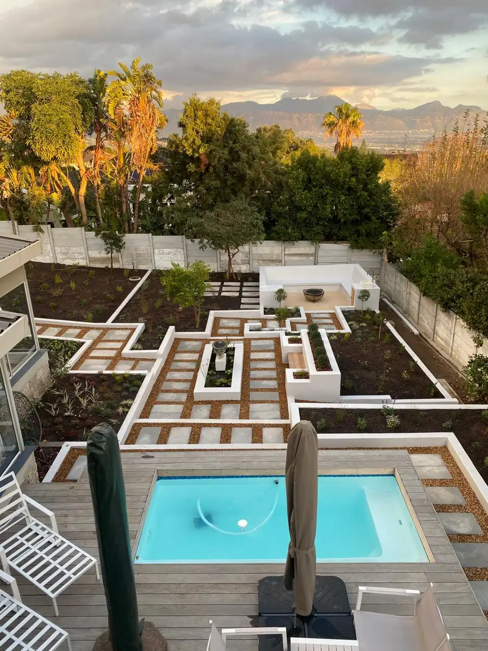 Grass, paving and white pebble combo by Mis-tic Landscaping in Cape Town, photo 1