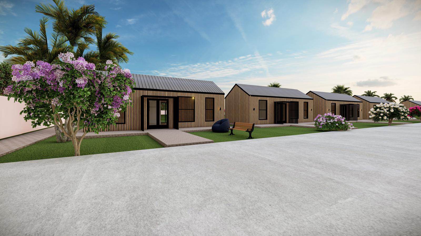 Tiny homes beside a blooming crepe myrtle and a bench