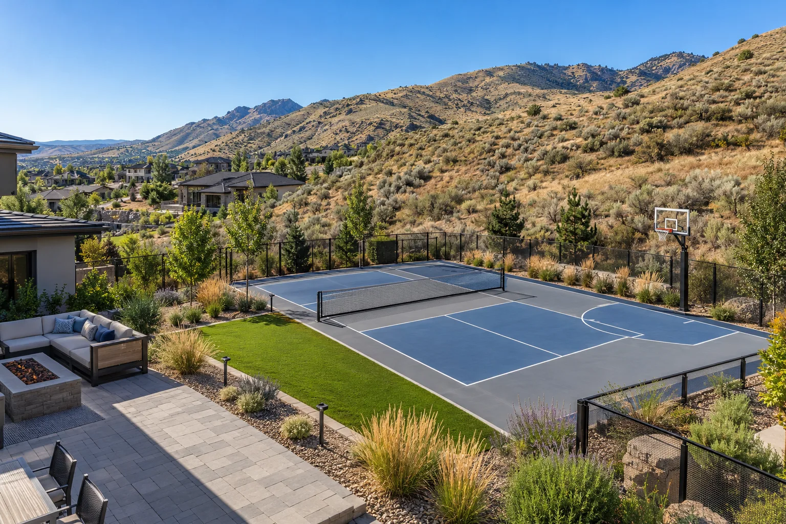 Wide view of a multi-use backyard sport court with pickleball lines, half court, and fencing in east Boise, Idaho