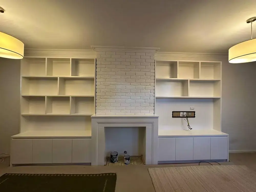 Custom shelving and fireplace surround