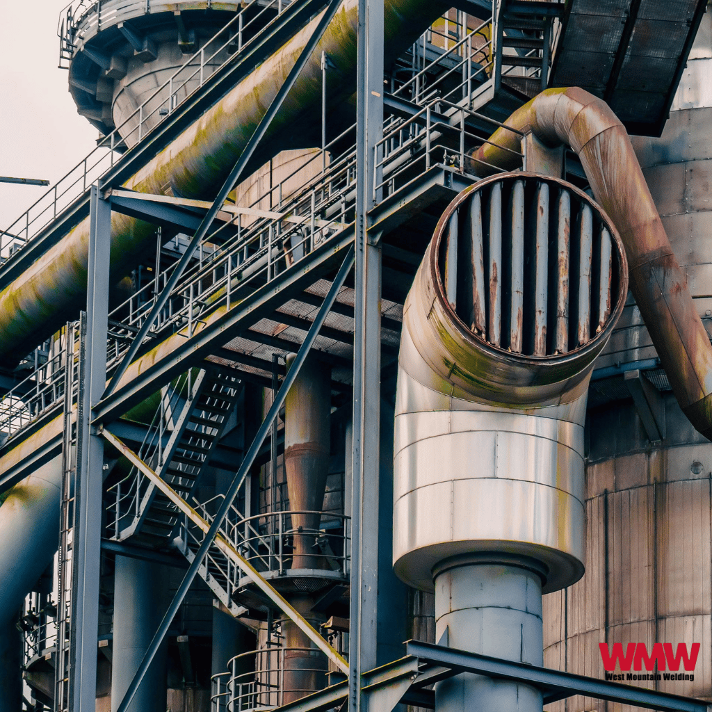 Weathered industrial facility with metal pipes and scaffolding highlighting carbon steel pipes applications. Weathered industrial facility with metal pipes and scaffolding highlighting carbon steel pipes applications.
