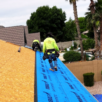 Professional roofers San Tan Valley installing high-quality synthetic underlayment during a comprehensive roof replacement San Tan Valley AZ.