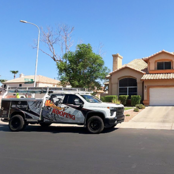 Arizona's Finest Roofing service truck parked outside a suburban home for residential roofing Gilbert AZ services.