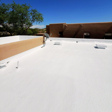 High-reflectivity foam roofing coating applied to a residential roof by a top roofing company Phoenix AZ.