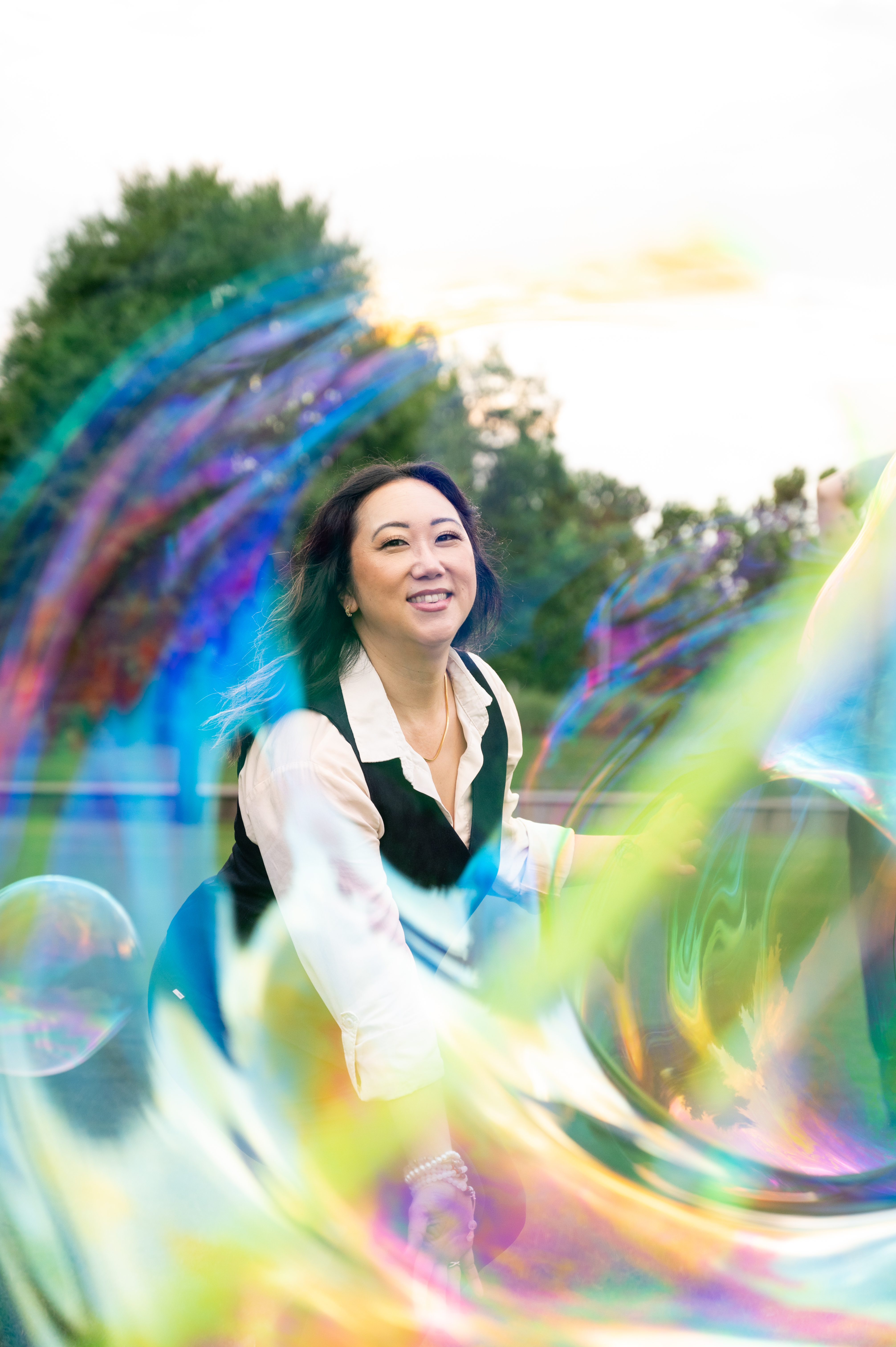 Sora smiling through luminous bubbles outdoors