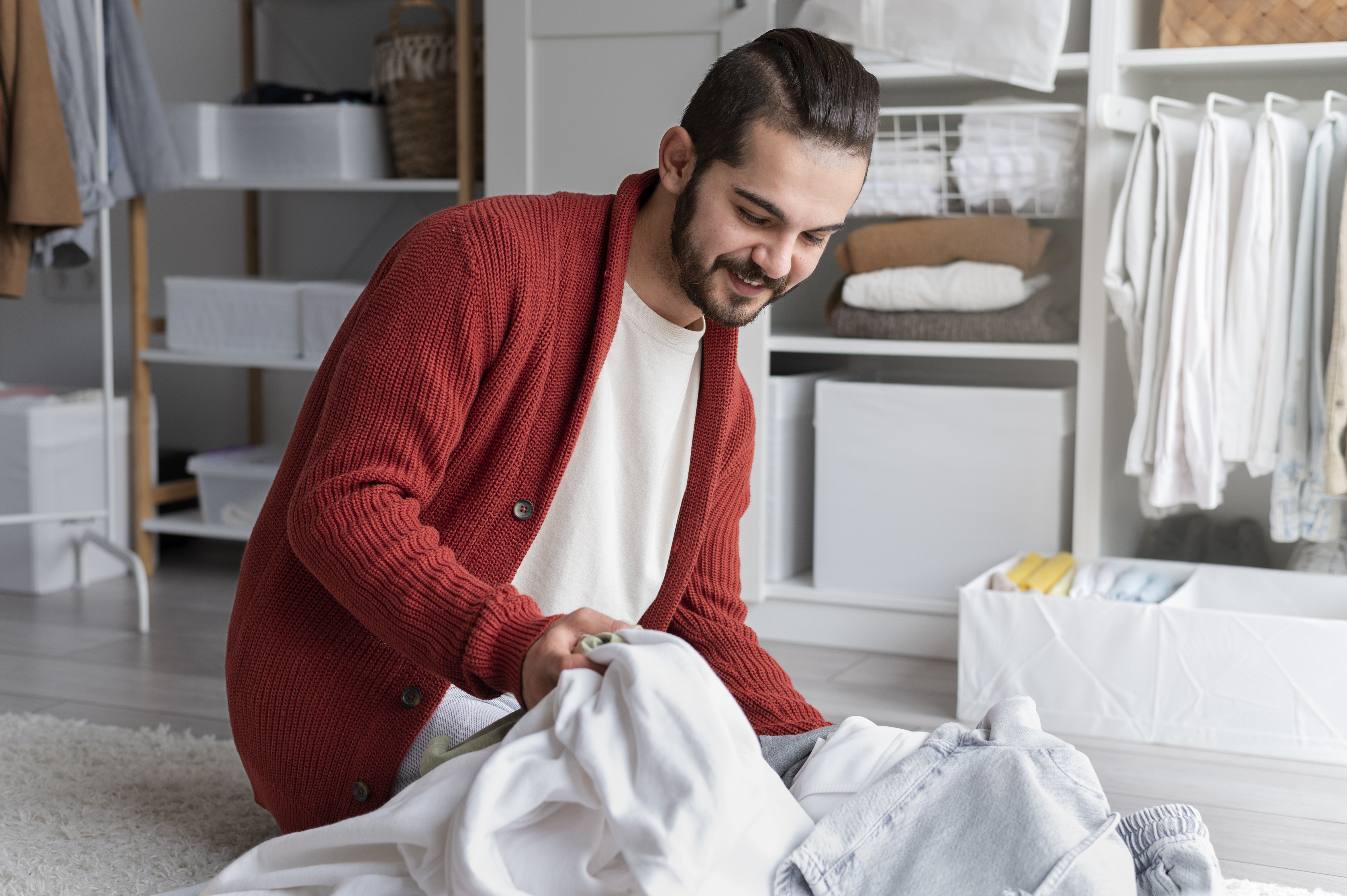 Happy person folding laundry