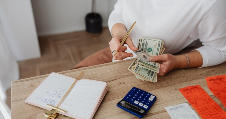 Self-employed professional calculating projected annual income to apply for ACA health insurance. Self-employed professional calculating projected annual income to apply for ACA health insurance.