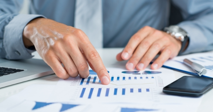 Couple discussing pre-retirement planning and future healthcare expenses with financial advisor. Couple discussing pre-retirement planning and future healthcare expenses with financial advisor.