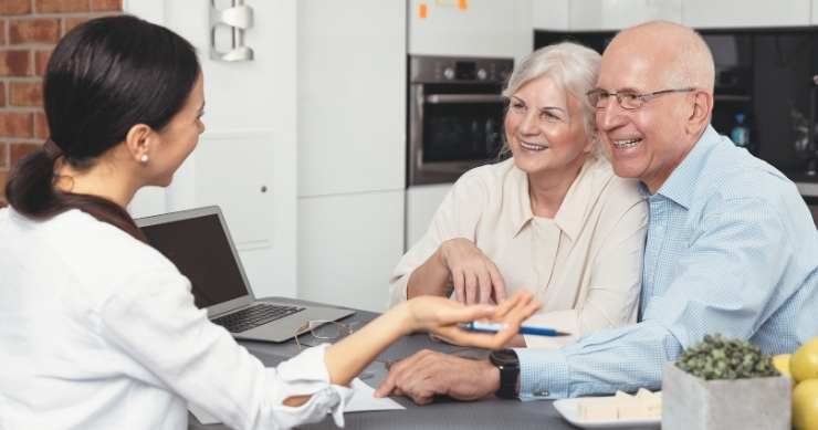 Retired couple planning retirement savings to build long-term financial security. Retired couple planning retirement savings to build long-term financial security.