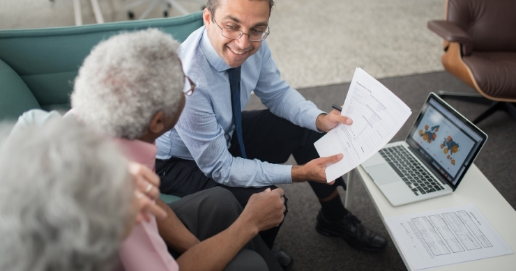 Retiree reviewing principal protection strategies to preserve retirement savings. Retiree reviewing principal protection strategies to preserve retirement savings.