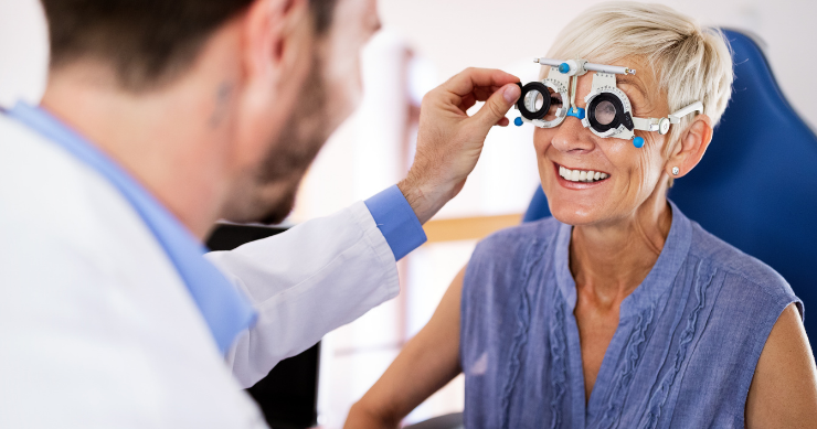 Optometrist conducting an eye examination for a patient in a specialty medical clinic.