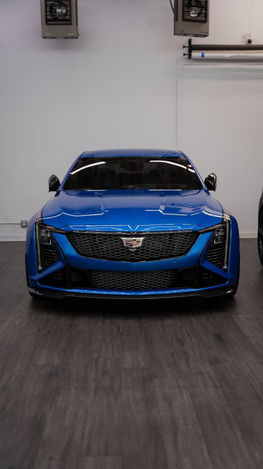 Blue Cadillac CT5-V Blackwing with tinted windows, front view