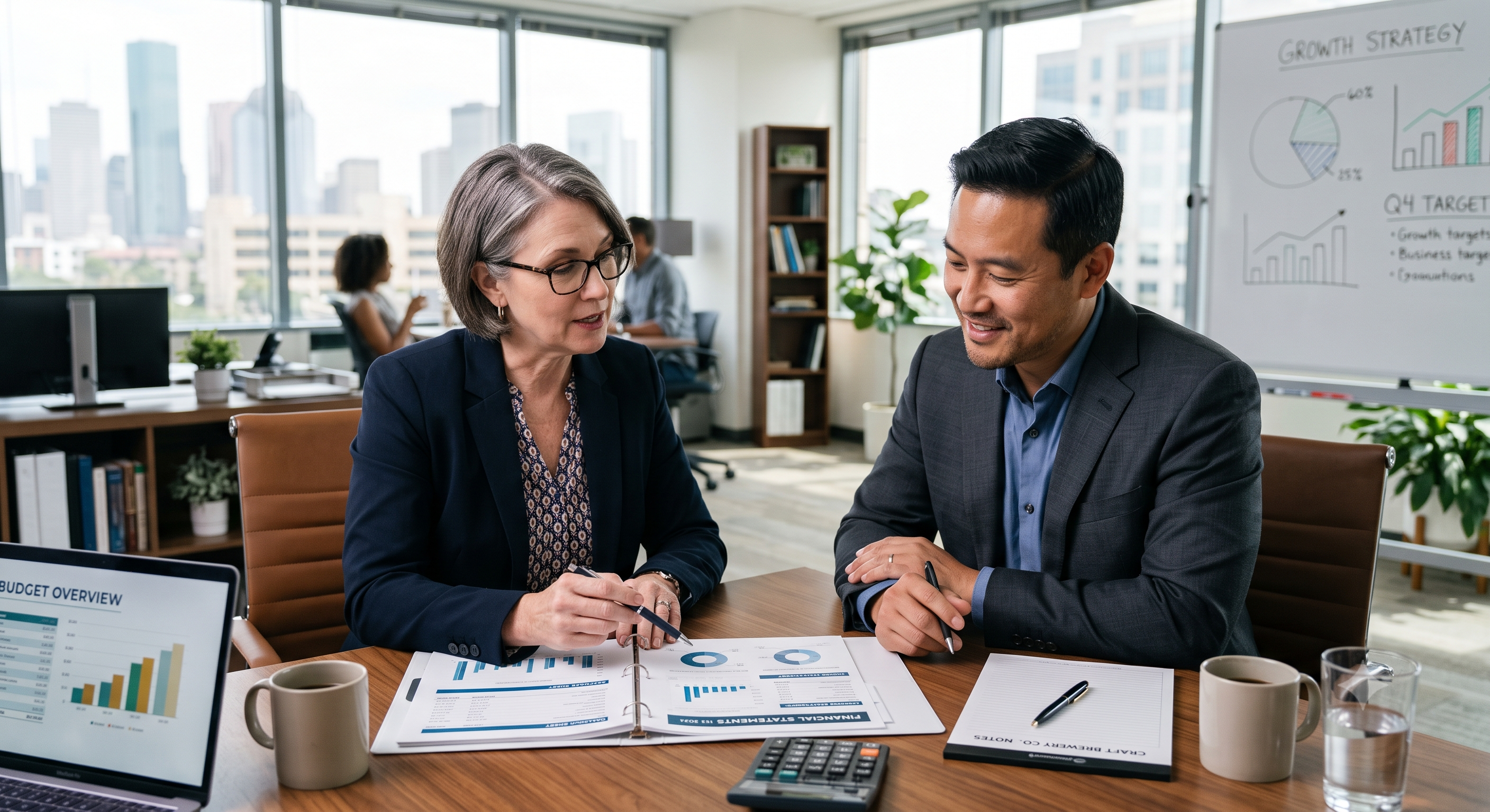 Professional accountant pointing to financial reports during a consultation meeting with a small business client. Professional accountant pointing to financial reports during a consultation meeting with a small business client.