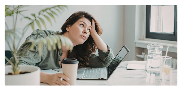 Stressed woman staring at computer Stressed woman staring at computer