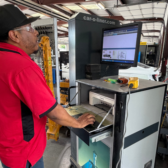 A collision repair tech working at the Car-O-Liner terminal