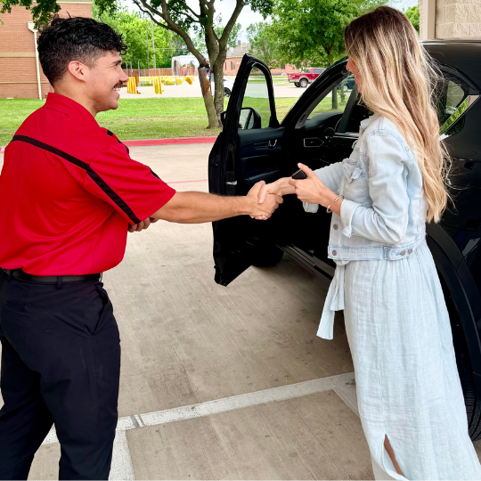 A B&D Collision service advisor in Mesquite shaking hands with a happy customer